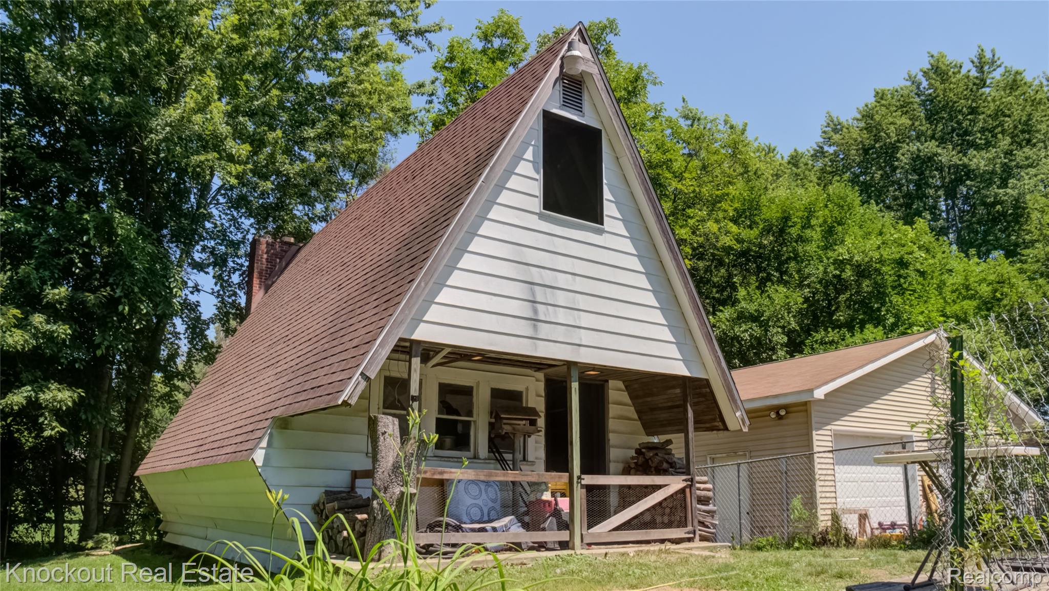 4195 Williamson Road Saginaw, MI 48601 - Photo 46 of 50 A-frame residence featuring white siding and a brown shingle roof