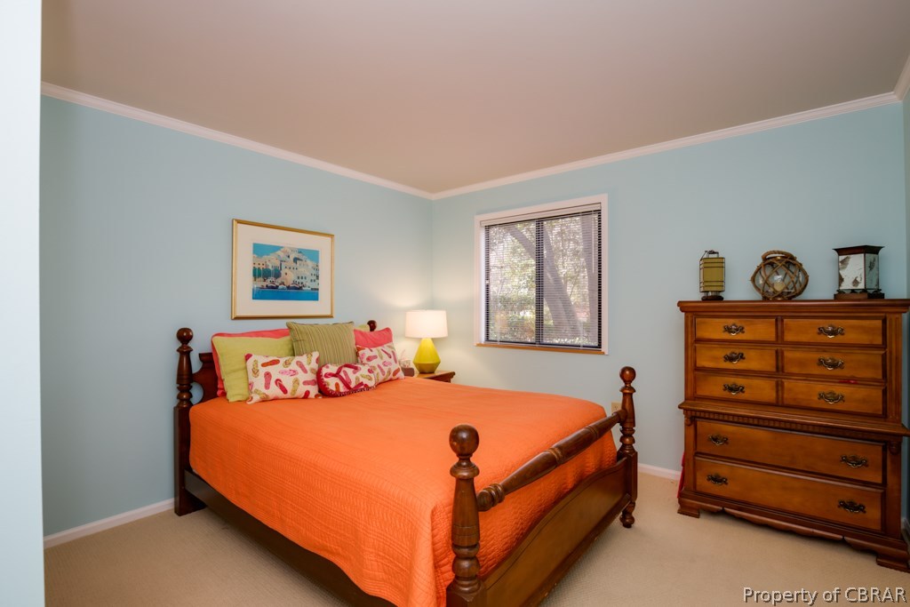 63 Mariners Point Lane, Unit A Hartfield, VA 23071 - Photo 16 of 29 Lovely guest bedroom looks out to the front of the home