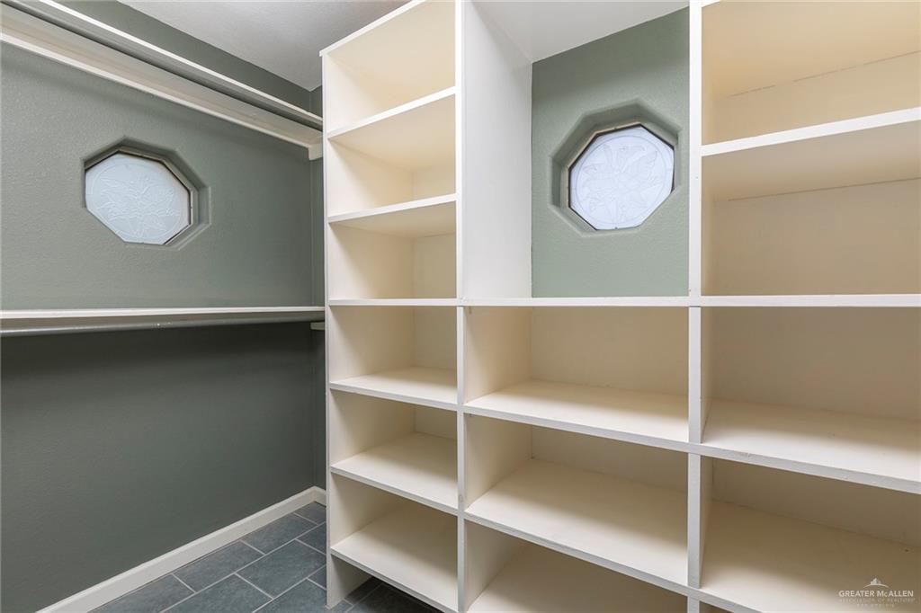 100 West Moore Road, Unit UT1 Pharr, TX 78577 - Photo 12 of 21 Walk in closet with dark tile patterned floors