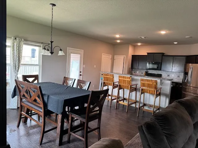 a view of a dining room with furniture