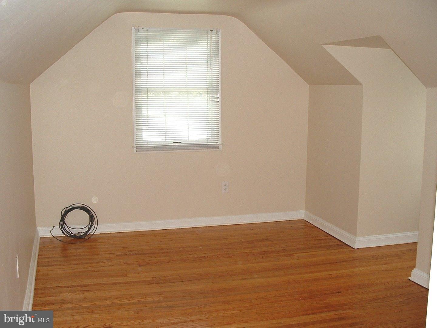 110 Barren Road Newtown Square, PA 19073 - Photo 9 of 15 a view of a room with wooden floor and windows