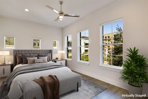 a bedroom with bed and a window