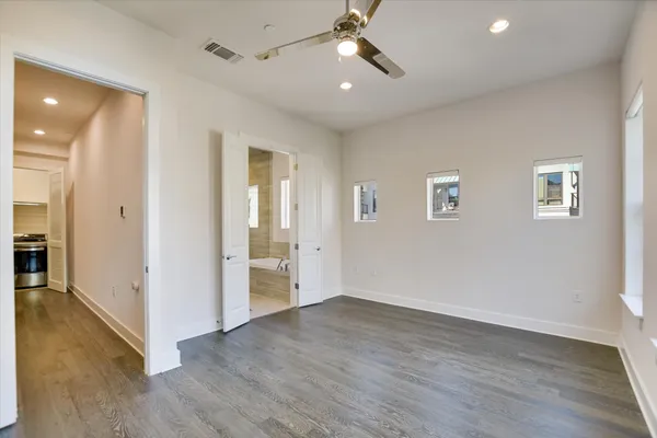 a spacious bathroom with a granite countertop tub sink and mirror