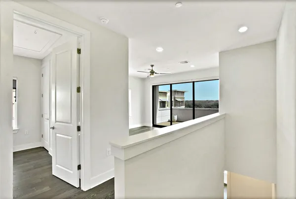 a bathroom with a granite countertop sink a toilet a large mirror and shower