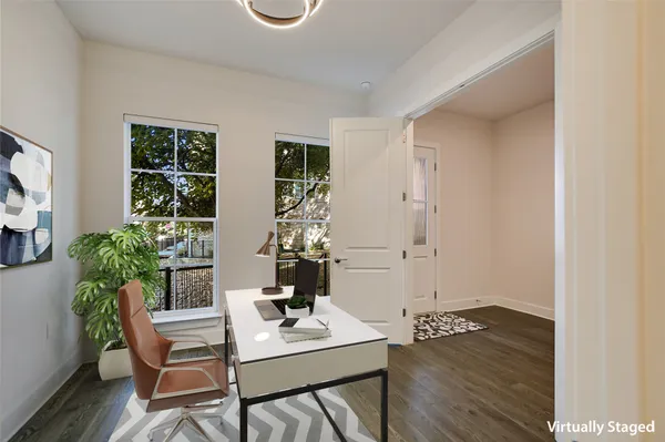 a workspace with furniture and window
