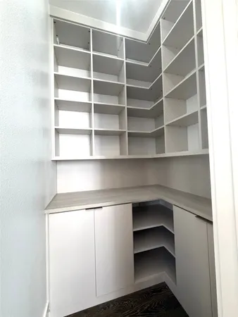 a kitchen with stainless steel appliances a sink a stove and a wooden floors