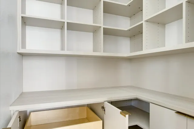 a view of an empty walk in closet