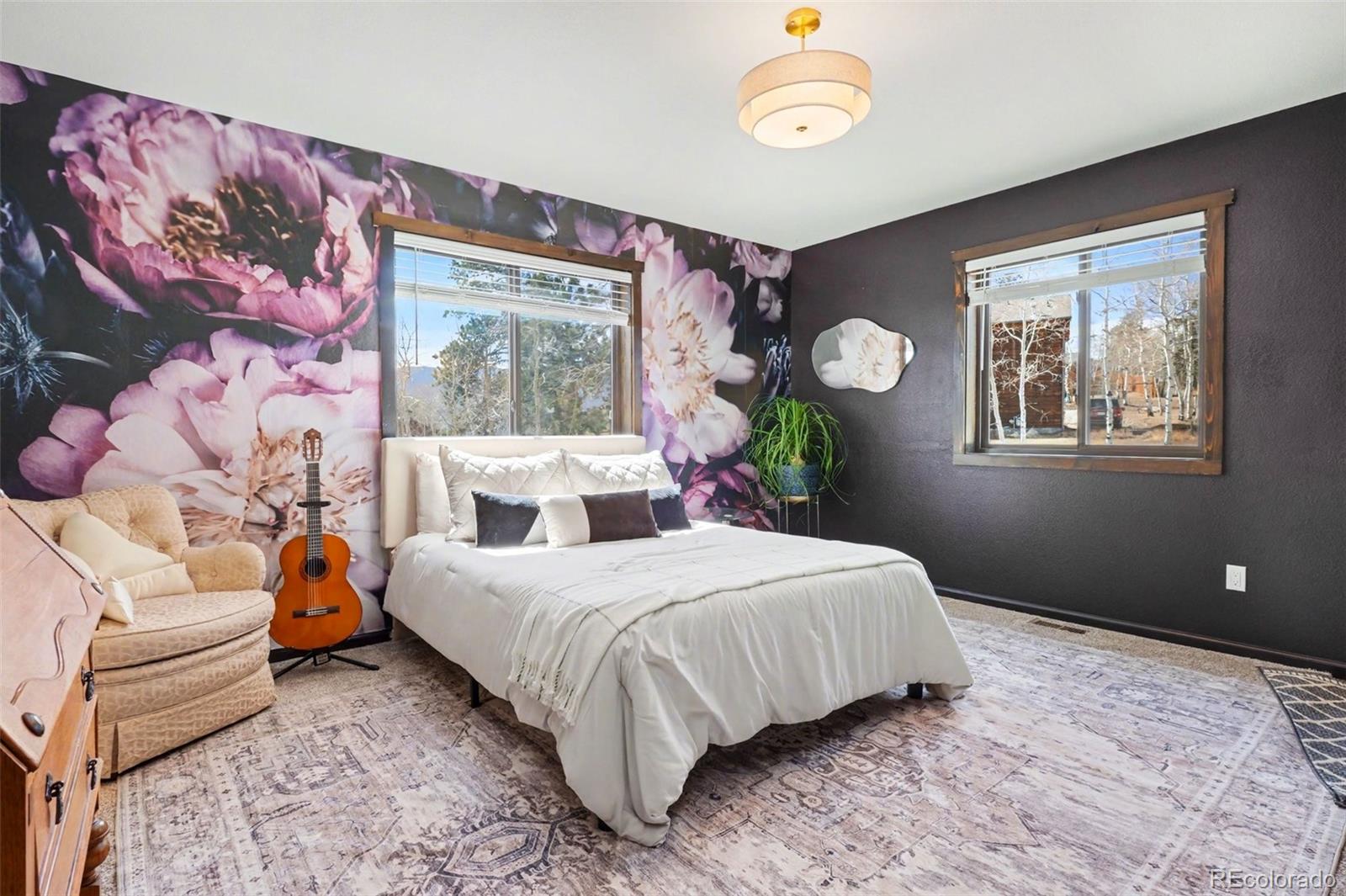 38 Pinon Road Bailey, CO 80421 - Photo 11 of 26 a bedroom with a bed and a window