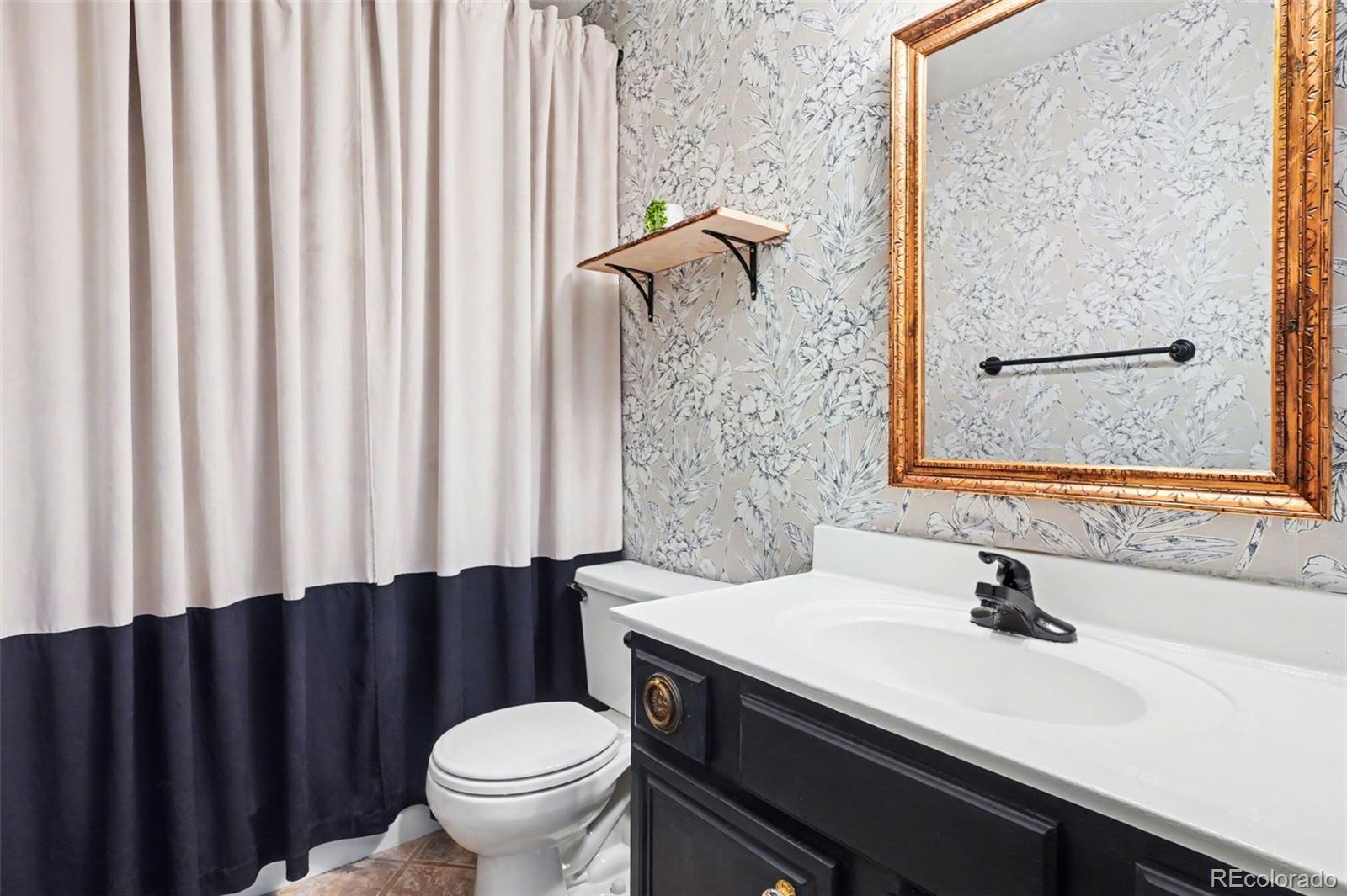 38 Pinon Road Bailey, CO 80421 - Photo 16 of 26 a bathroom with a sink toilet and shower