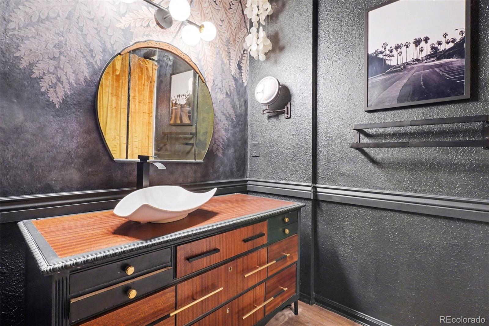 38 Pinon Road Bailey, CO 80421 - Photo 19 of 26 a room with a table and a mirror