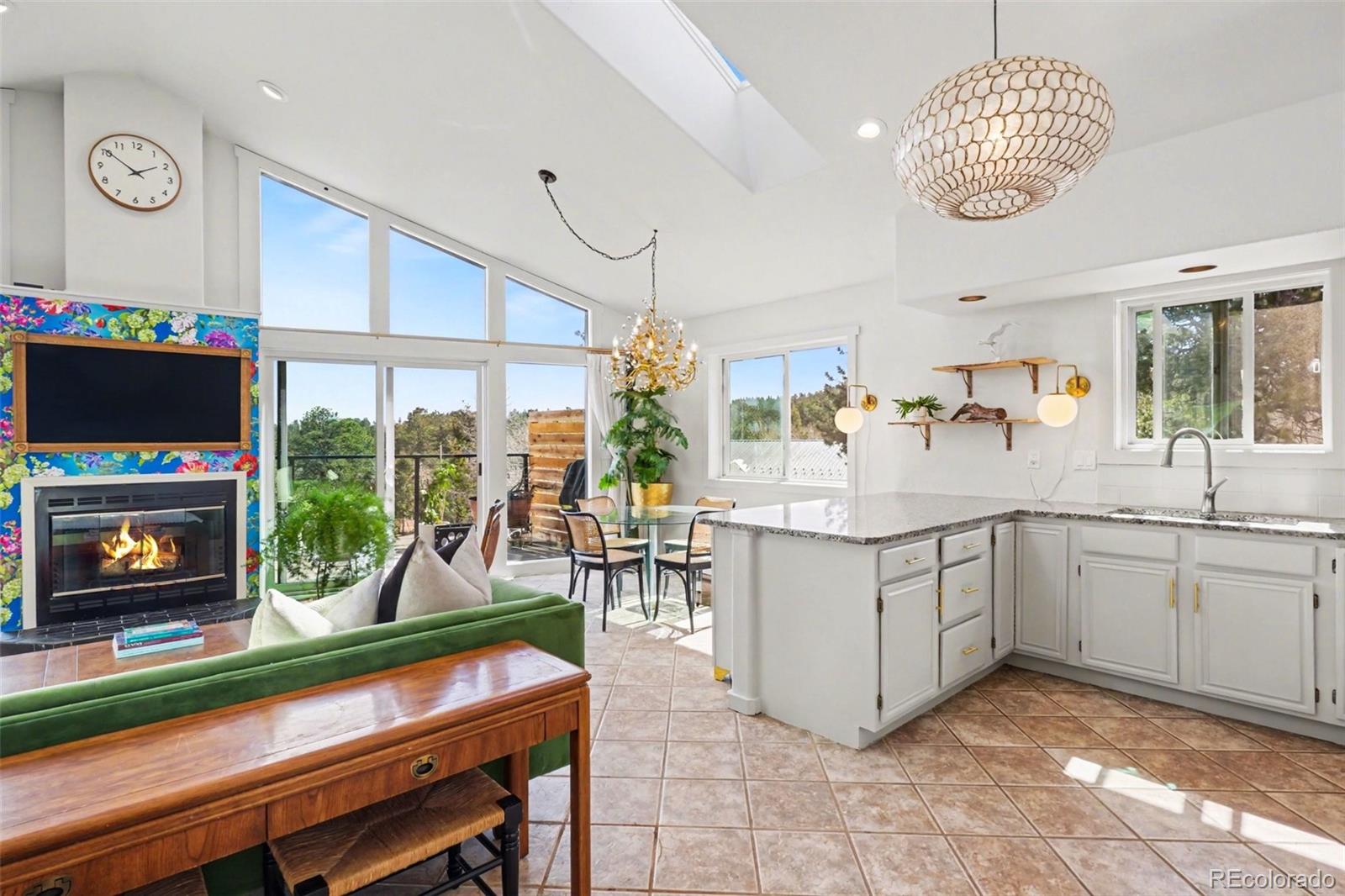 38 Pinon Road Bailey, CO 80421 - Photo 6 of 26 a kitchen with counter and windows