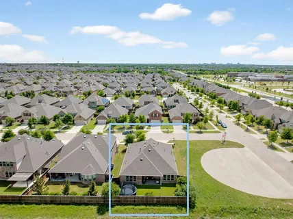 an aerial view of a houses with outdoor space swimming pool and outdoor seating