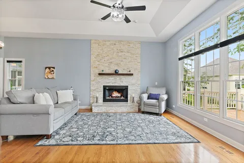 a living room with furniture and a fireplace