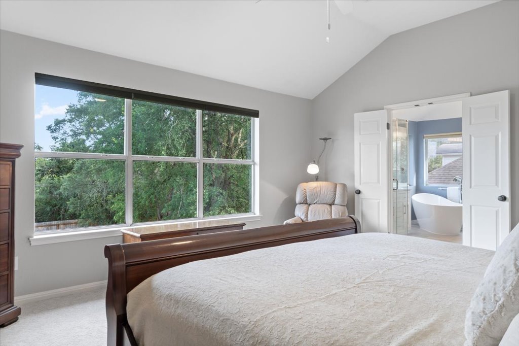 10801 Beachmont Lane Austin, TX 78739 - Photo 16 of 40 Wake up to the sunrise from your tranquil primary bedroom.