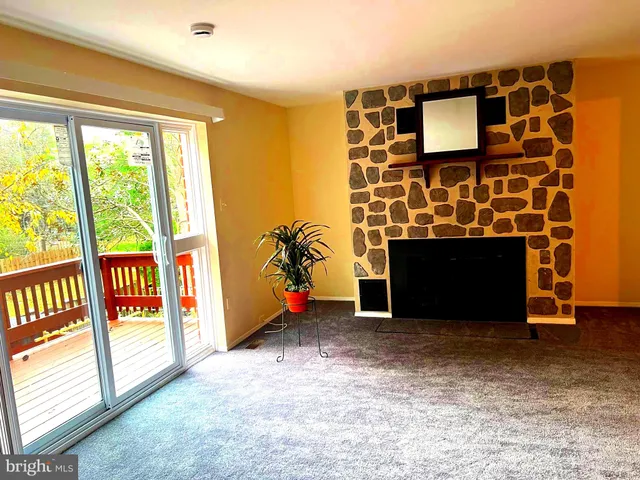 a kitchen with stainless steel appliances a stove a sink and a refrigerator