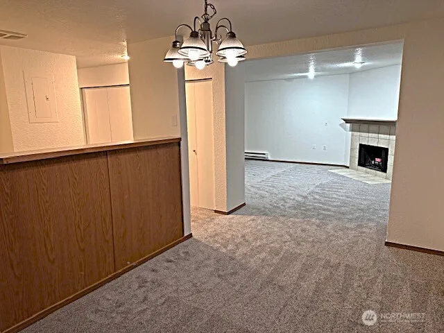 an empty room with fireplace