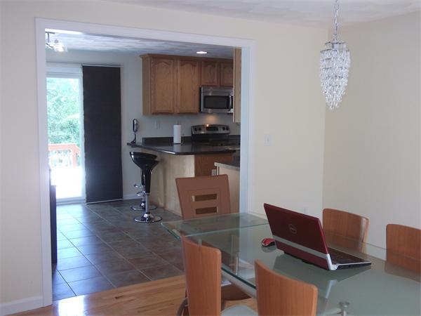 19 Ingersoll Road Billerica, MA 01821 - Photo 12 of 23 a living room with furniture and a kitchen counter space