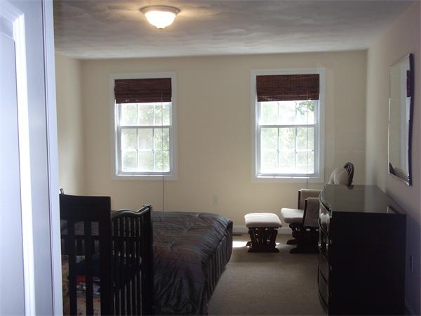 19 Ingersoll Road Billerica, MA 01821 - Photo 18 of 23 a hotel room with two beds and a window