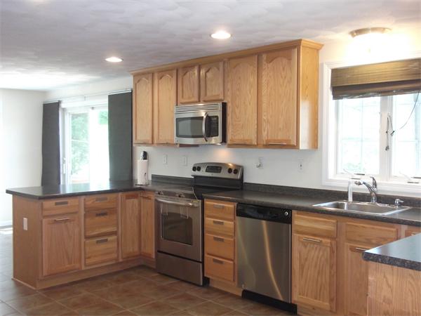 19 Ingersoll Road Billerica, MA 01821 - Photo 8 of 23 a kitchen with cabinets appliances a sink and a window