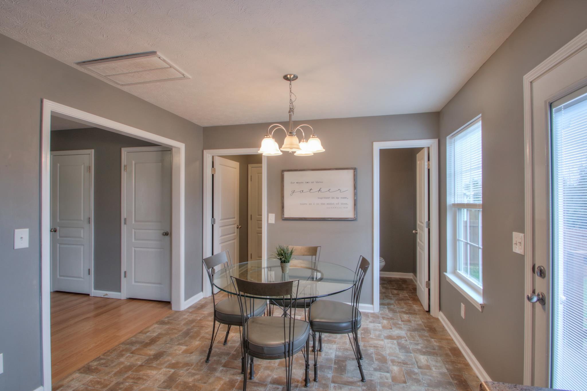 1209 Woodall Road Lebanon, TN 37090 - Photo 8 of 28 a view of a dining room with furniture and chandelier