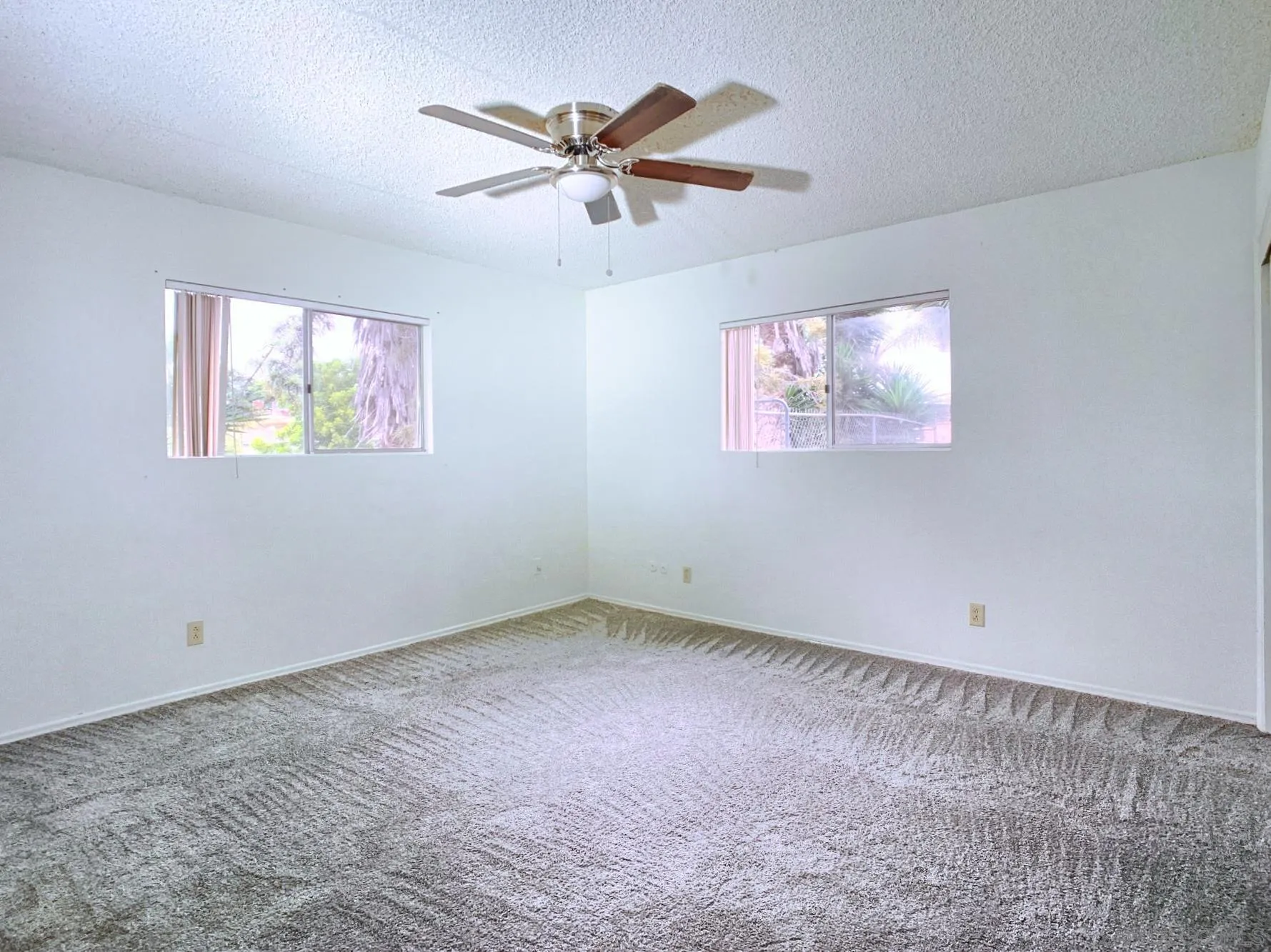 10111 Norte Mesa Drive Spring Valley, CA 91977 - Photo 17 of 29 an empty room with a window and a ceiling fan