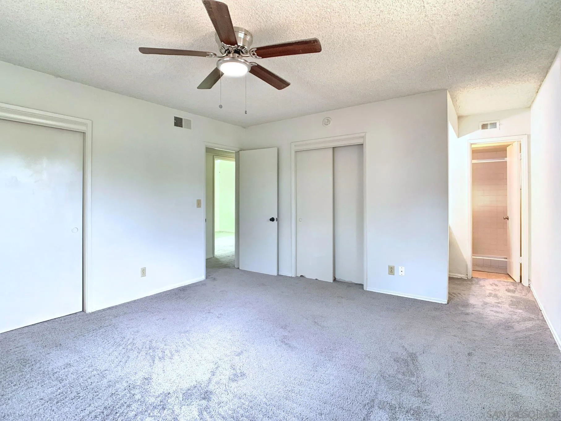 10111 Norte Mesa Drive Spring Valley, CA 91977 - Photo 19 of 29 an empty room with chandelier fan