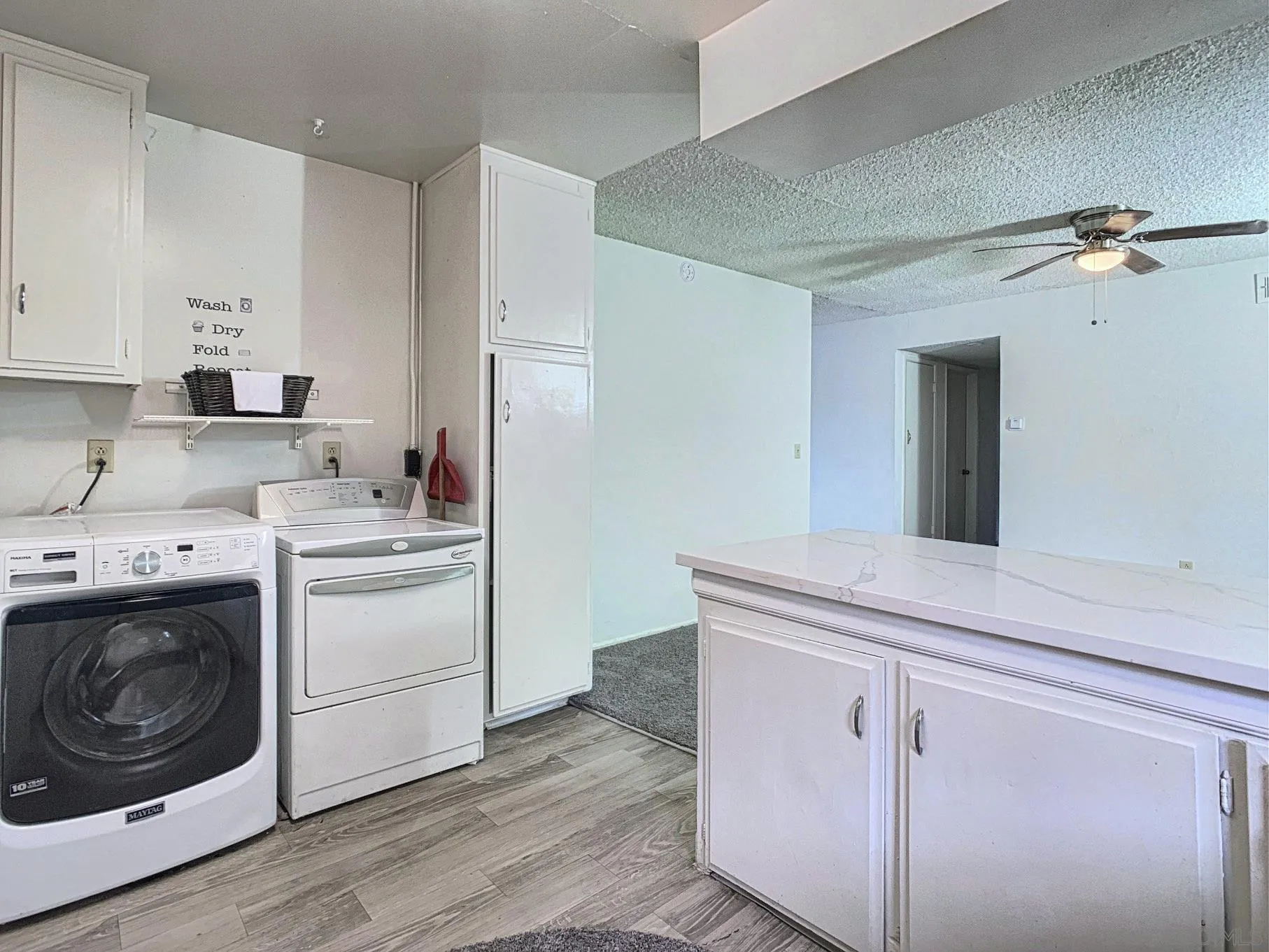 10111 Norte Mesa Drive Spring Valley, CA 91977 - Photo 10 of 29 a utility room with cabinets washer and dryer