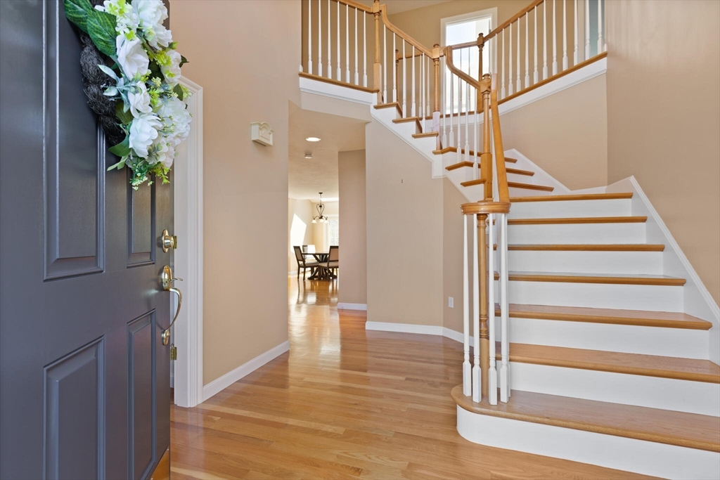 216 Berlin Road Bolton, MA 01740 - Photo 3 of 38 a view of entryway and hall with wooden floor