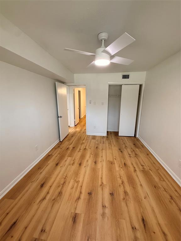 3933 Inwood Road, Unit 2023 Dallas, TX 75209 - Photo 13 of 24 a view of empty room with wooden floor