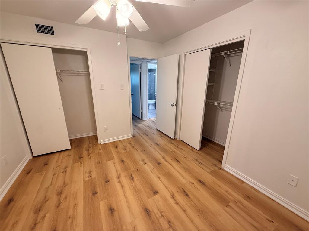 3933 Inwood Road, Unit 2023 Dallas, TX 75209 - Photo 17 of 24 an empty room with wooden floor and closet