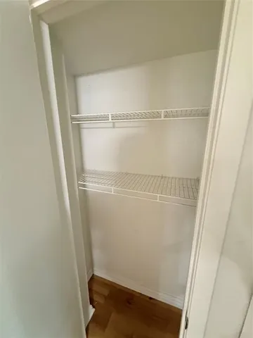 a view of an empty walk in closet