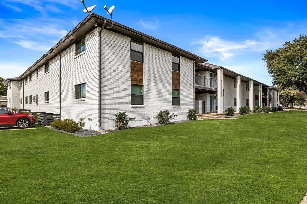 3933 Inwood Road, Unit 2023 Dallas, TX 75209 - Photo 23 of 24 a front view of house with yard and green space