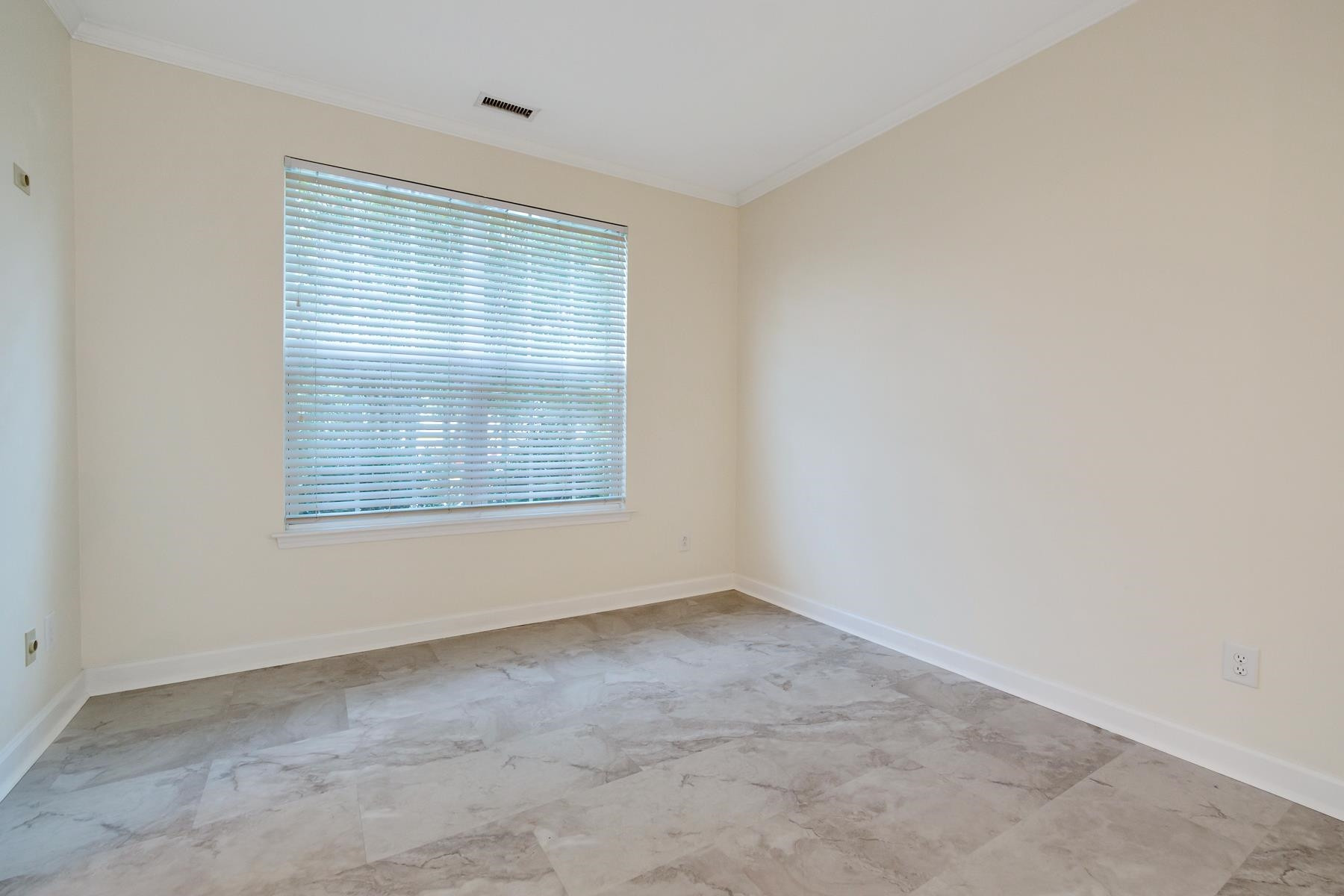 6316 Sparkling Brook Drive Raleigh, NC 27616 - Photo 19 of 44 an empty room with a window
