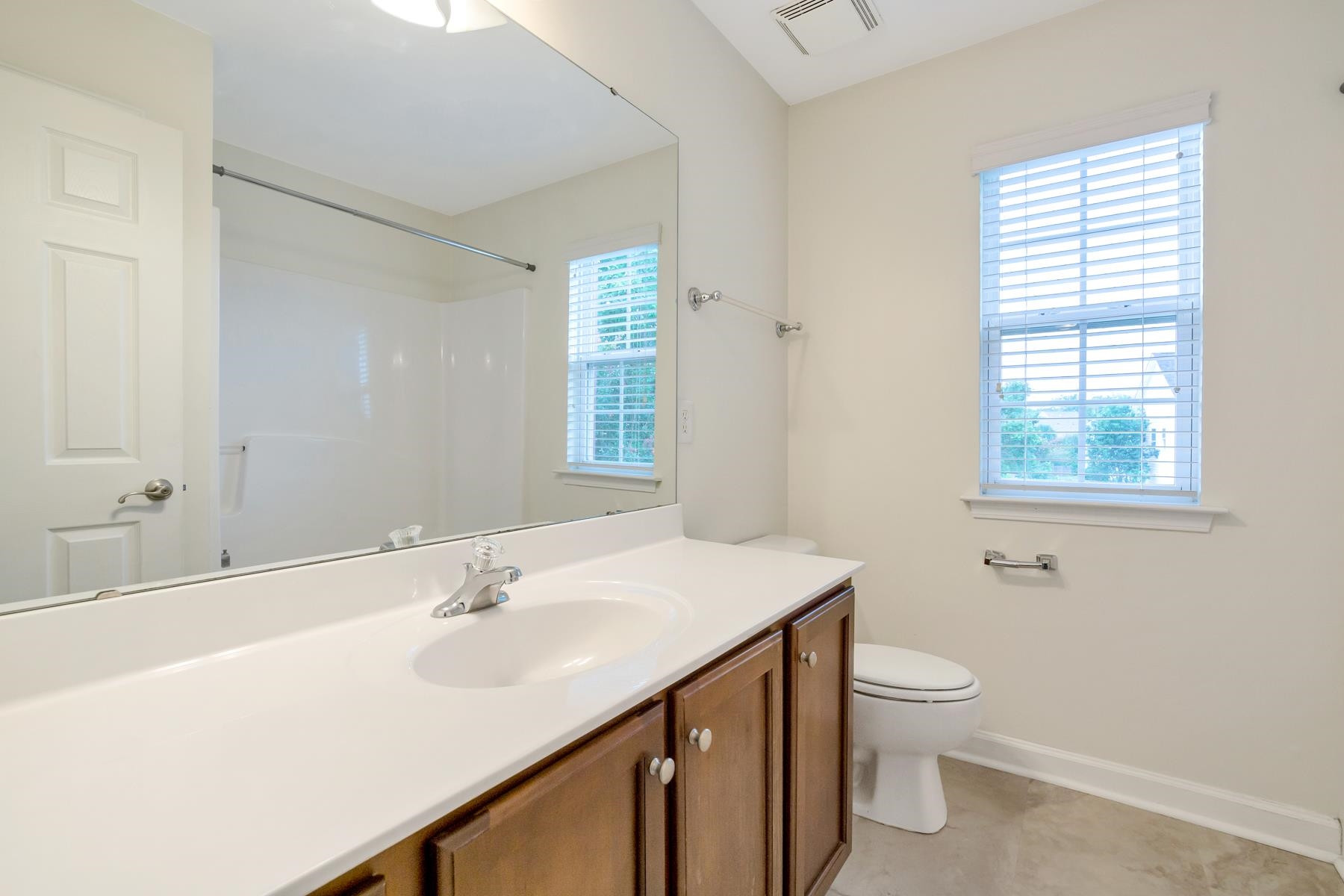 6316 Sparkling Brook Drive Raleigh, NC 27616 - Photo 24 of 44 a bathroom with a sink toilet and vanity
