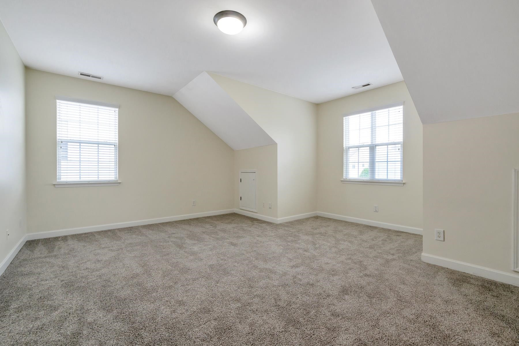 6316 Sparkling Brook Drive Raleigh, NC 27616 - Photo 25 of 44 an empty room with windows