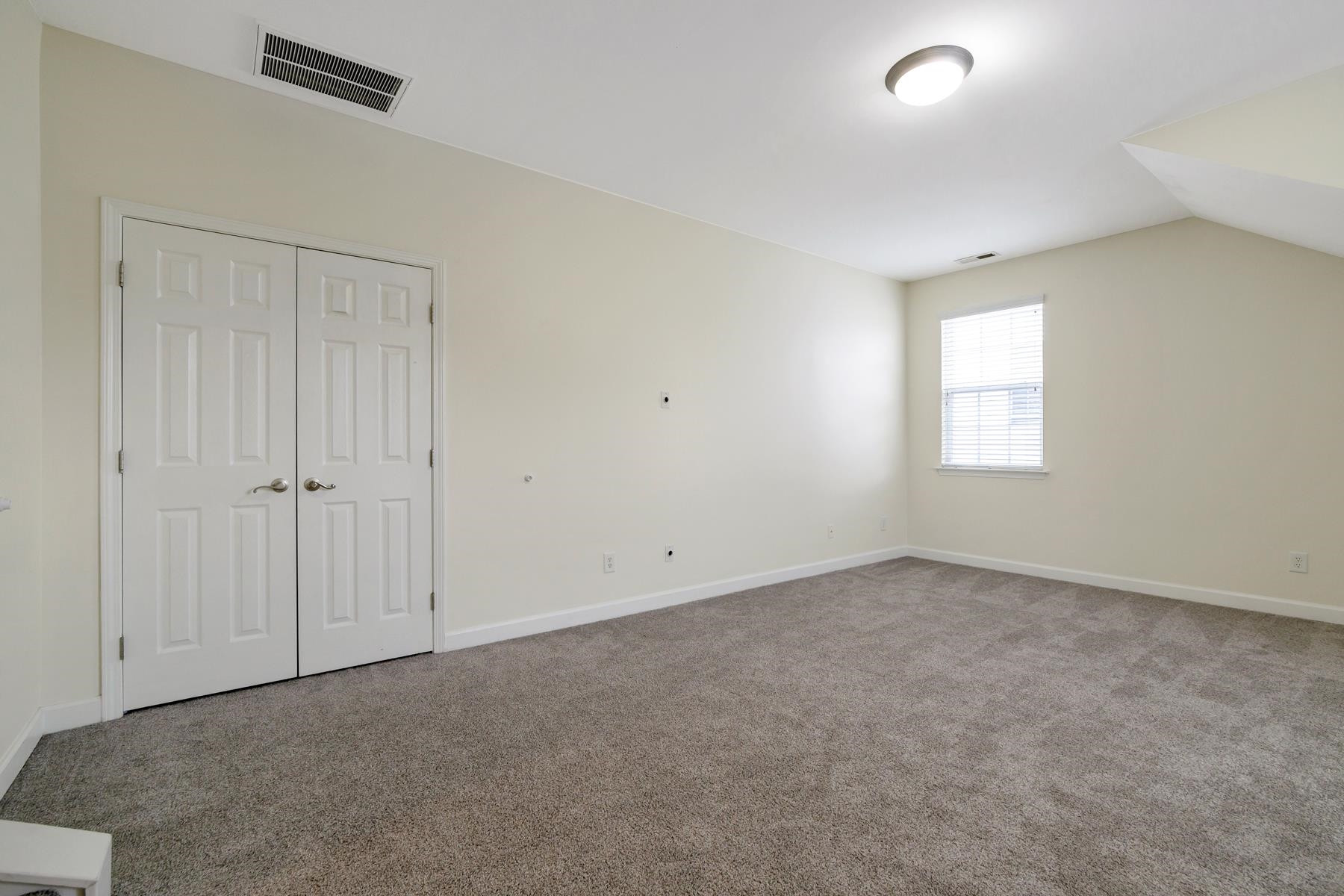 6316 Sparkling Brook Drive Raleigh, NC 27616 - Photo 26 of 44 an empty room with windows