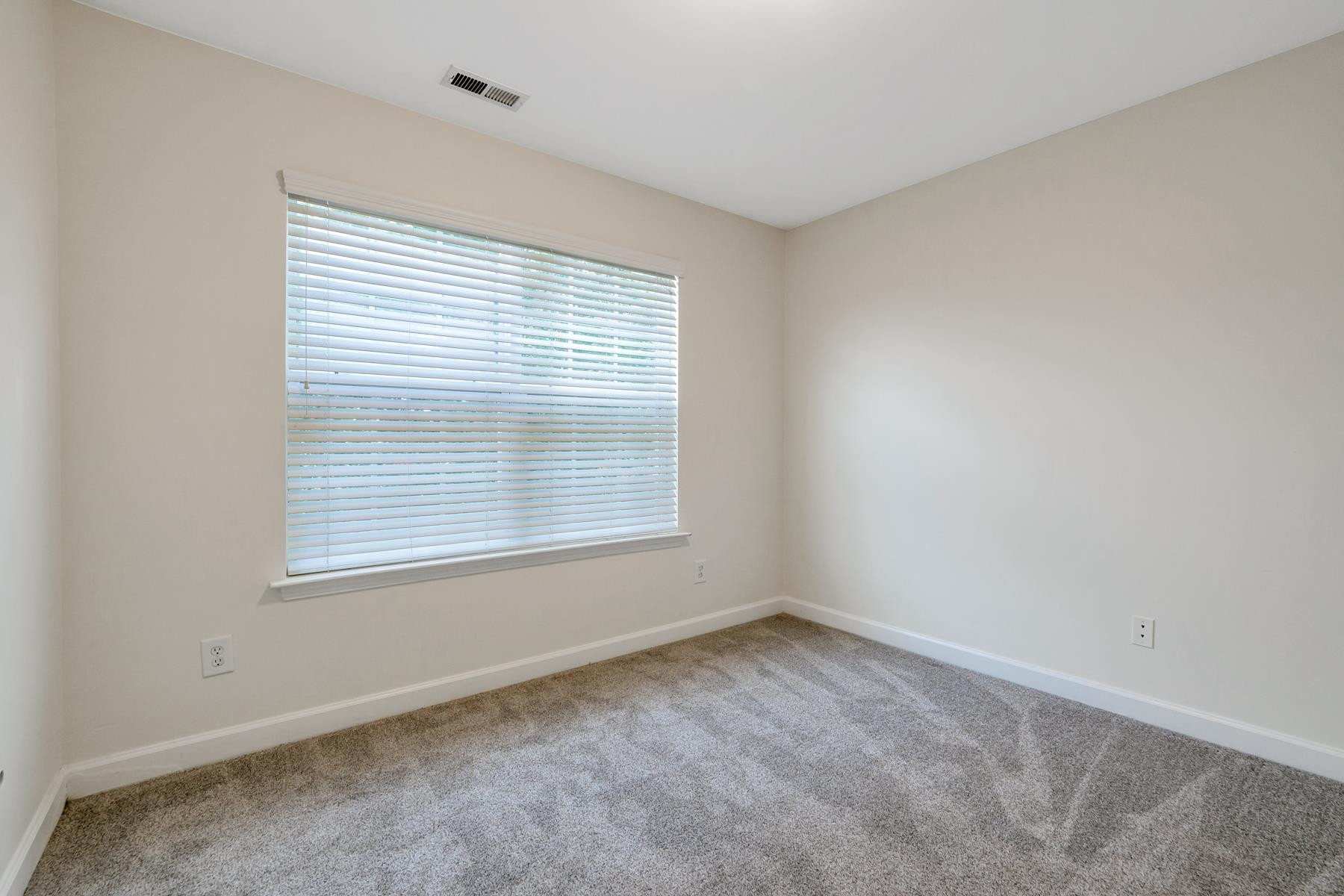 6316 Sparkling Brook Drive Raleigh, NC 27616 - Photo 27 of 44 an empty room with a window