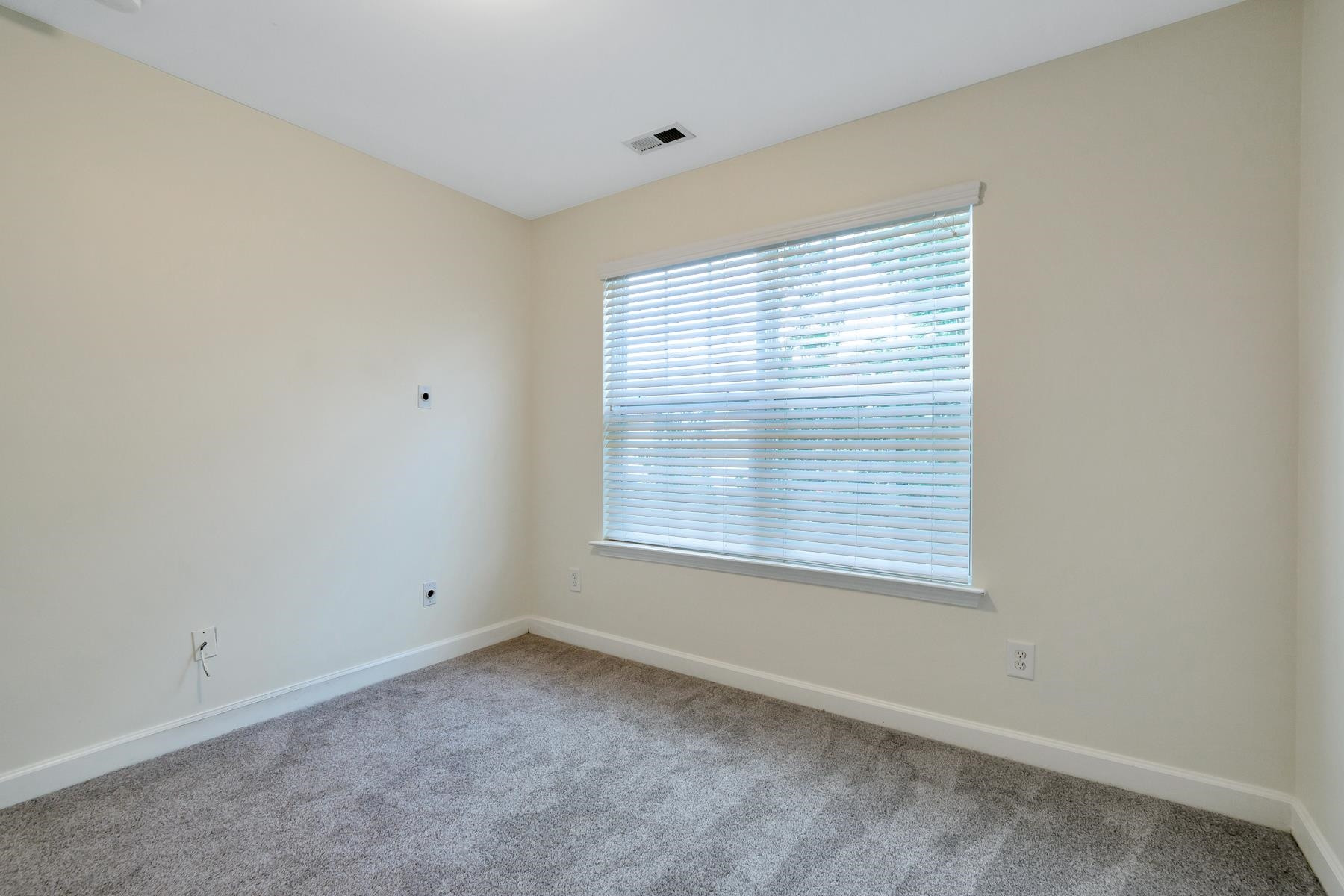 6316 Sparkling Brook Drive Raleigh, NC 27616 - Photo 28 of 44 a view of an empty room with a window