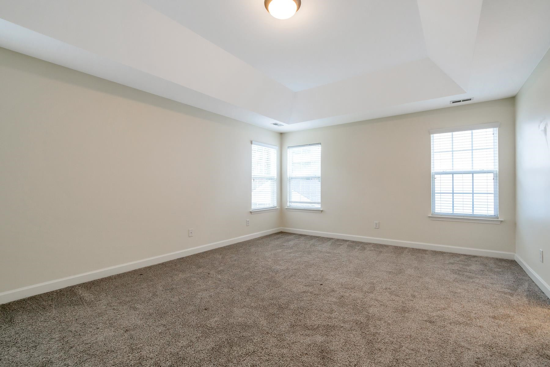 6316 Sparkling Brook Drive Raleigh, NC 27616 - Photo 31 of 44 an empty room with windows