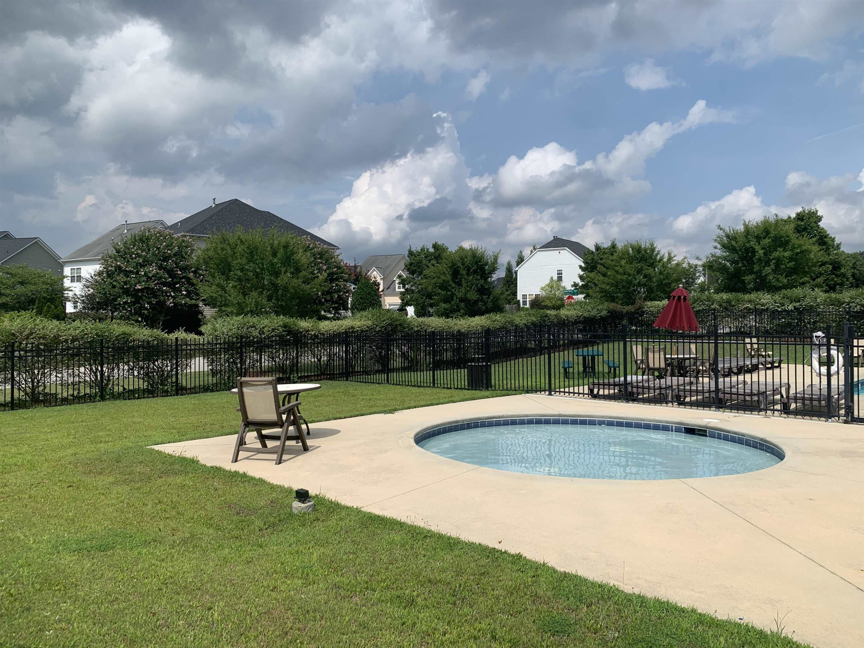 6316 Sparkling Brook Drive Raleigh, NC 27616 - Photo 43 of 44 a view of a backyard with swimming pool