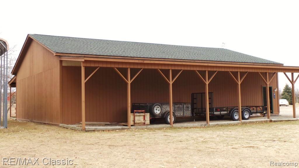 2447 North Hacker Road Howell, MI 48855 - Photo 46 of 62 40 x 56 pole barn with covered sides to store trailers