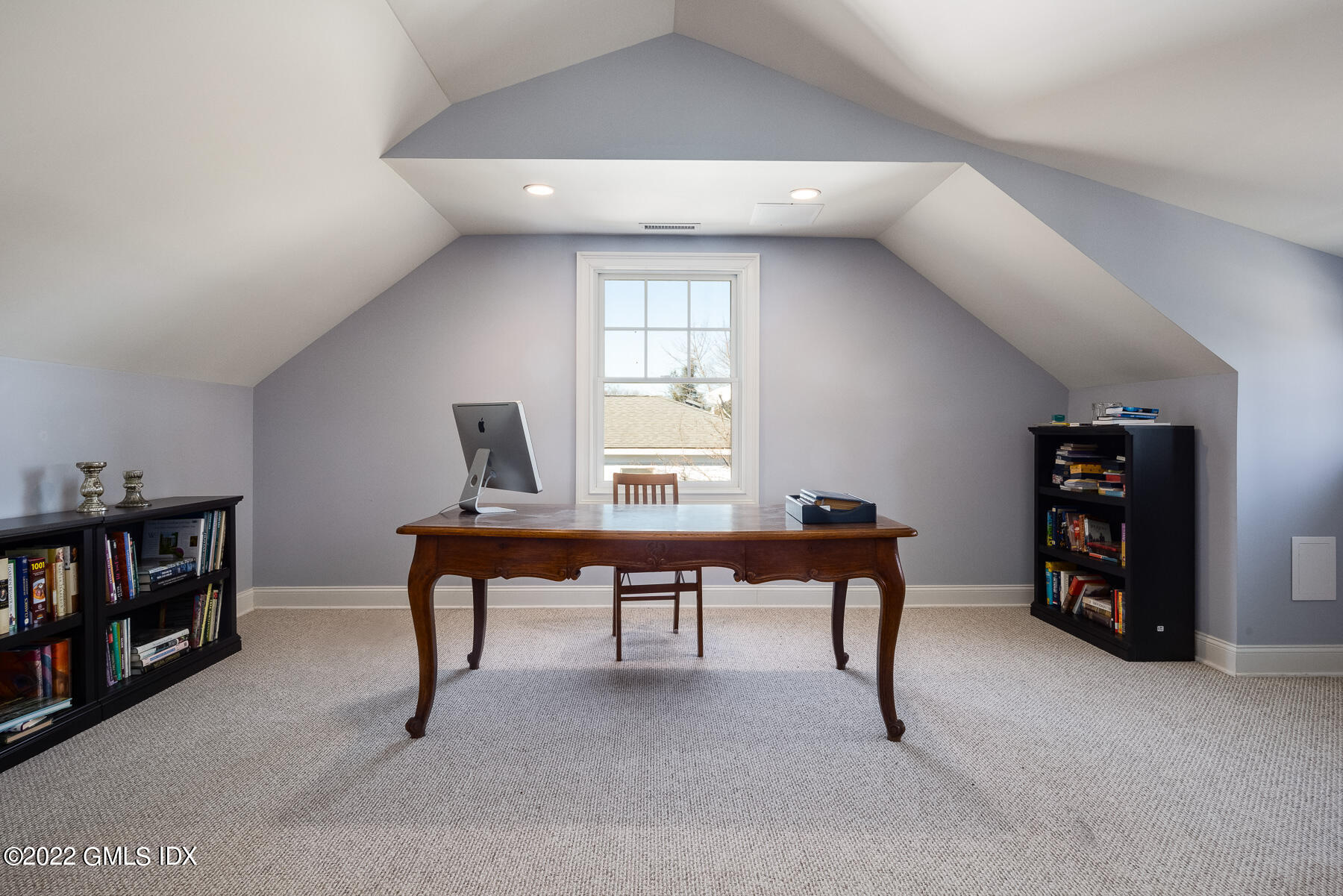 22 Widgeon Way Greenwich, CT 06830 - Photo 18 of 26 a view of a livingroom with furniture and a bookshelf