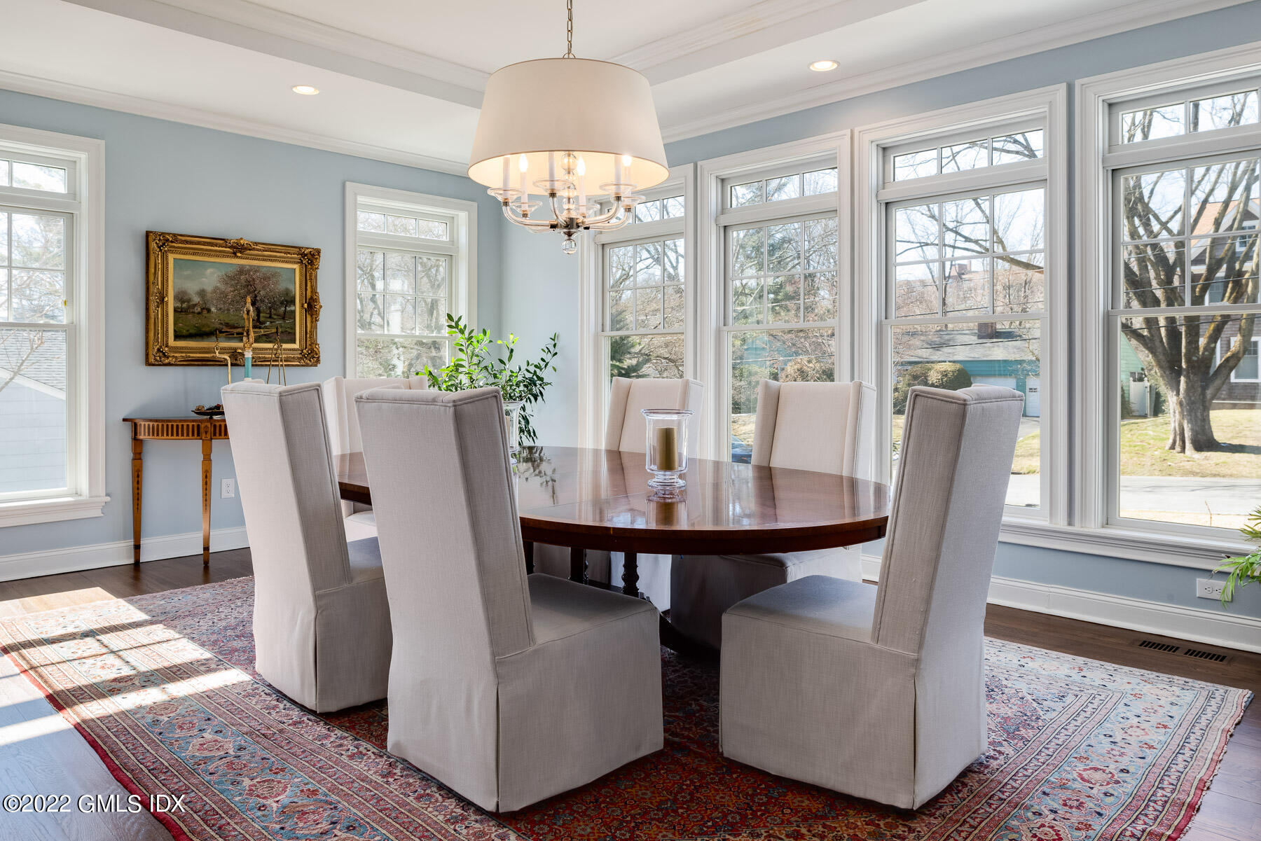 22 Widgeon Way Greenwich, CT 06830 - Photo 4 of 26 a dining room with furniture a chandelier and wooden floor