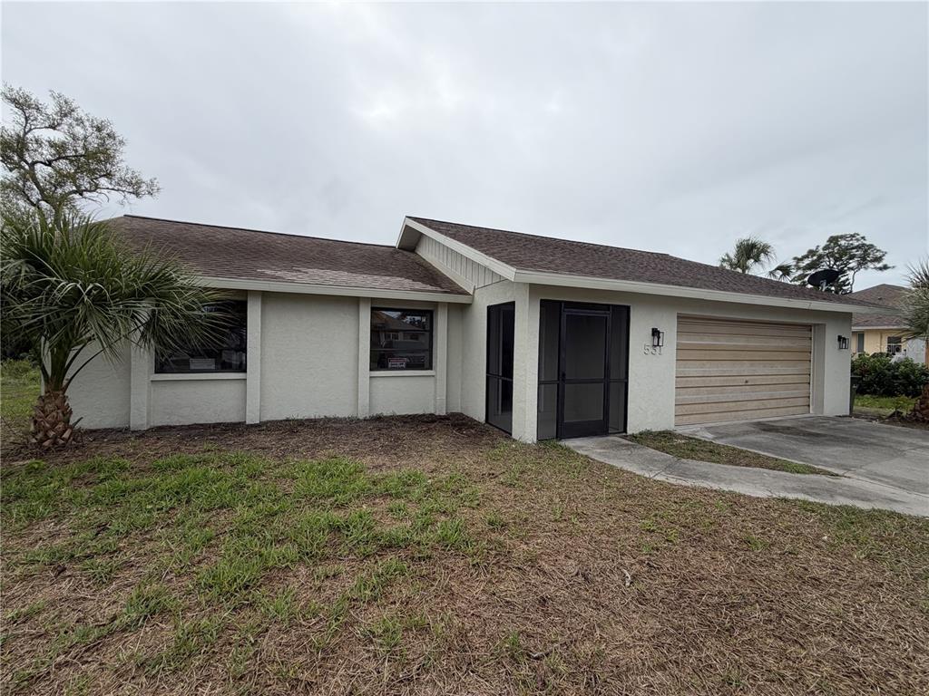 531 Baffin Drive Venice, FL 34293 - Photo 1 of 1 a view of a house with a yard and garage