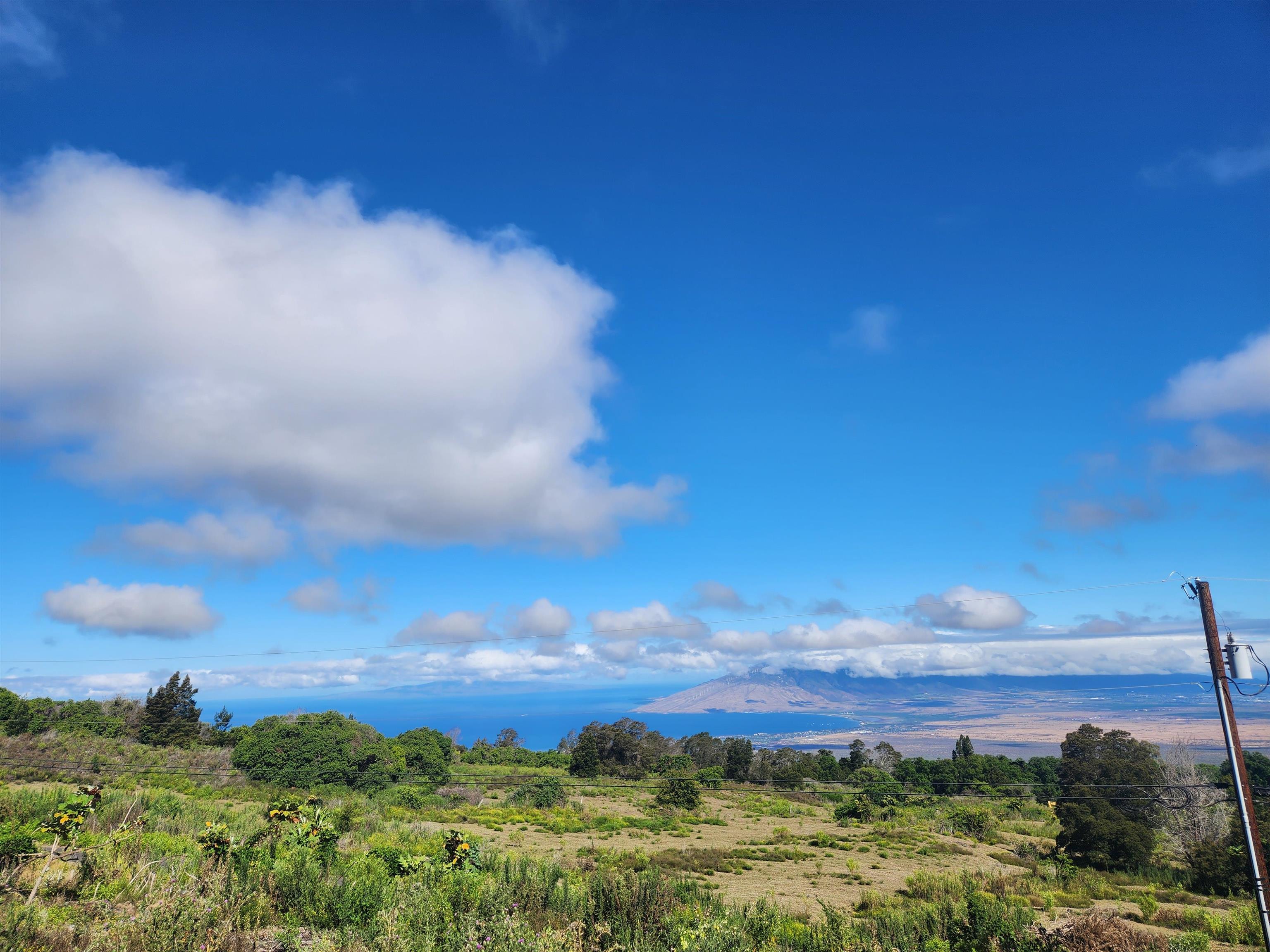 487 Cross Road Kula, HI 96790 - Photo 2 of 5 a view of a lake and sunset