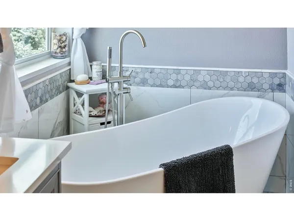 a bathroom with a sink and a shower