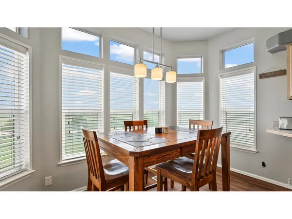 a dining room with furniture and chandelier