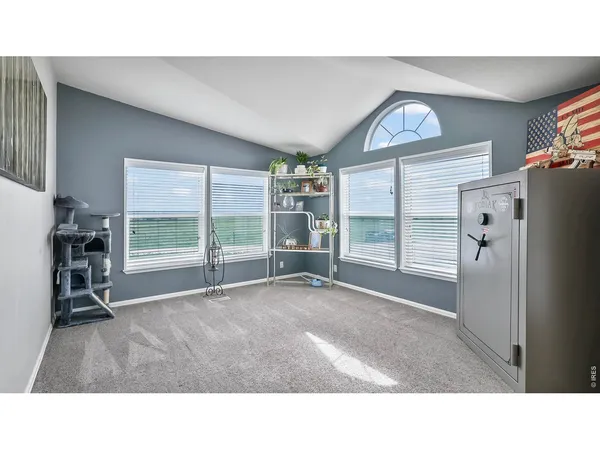 a bathroom with a sink vanity mirror and toilet
