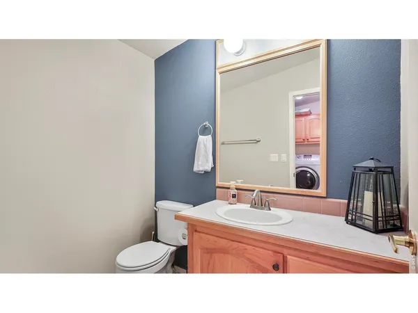 a bathroom with a sink a washer and dryer
