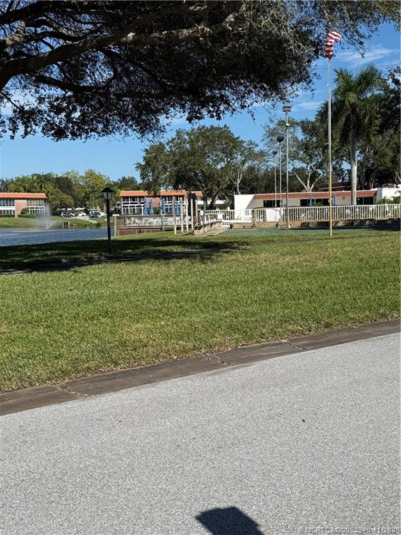 1225 Northwest 21st Street Northwest, Unit 2504 Stuart, FL 34994 - Photo 16 of 17 a view of a lake with houses